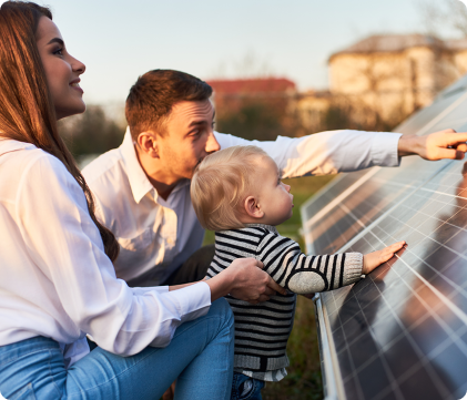 a couple and child touching a solar panel